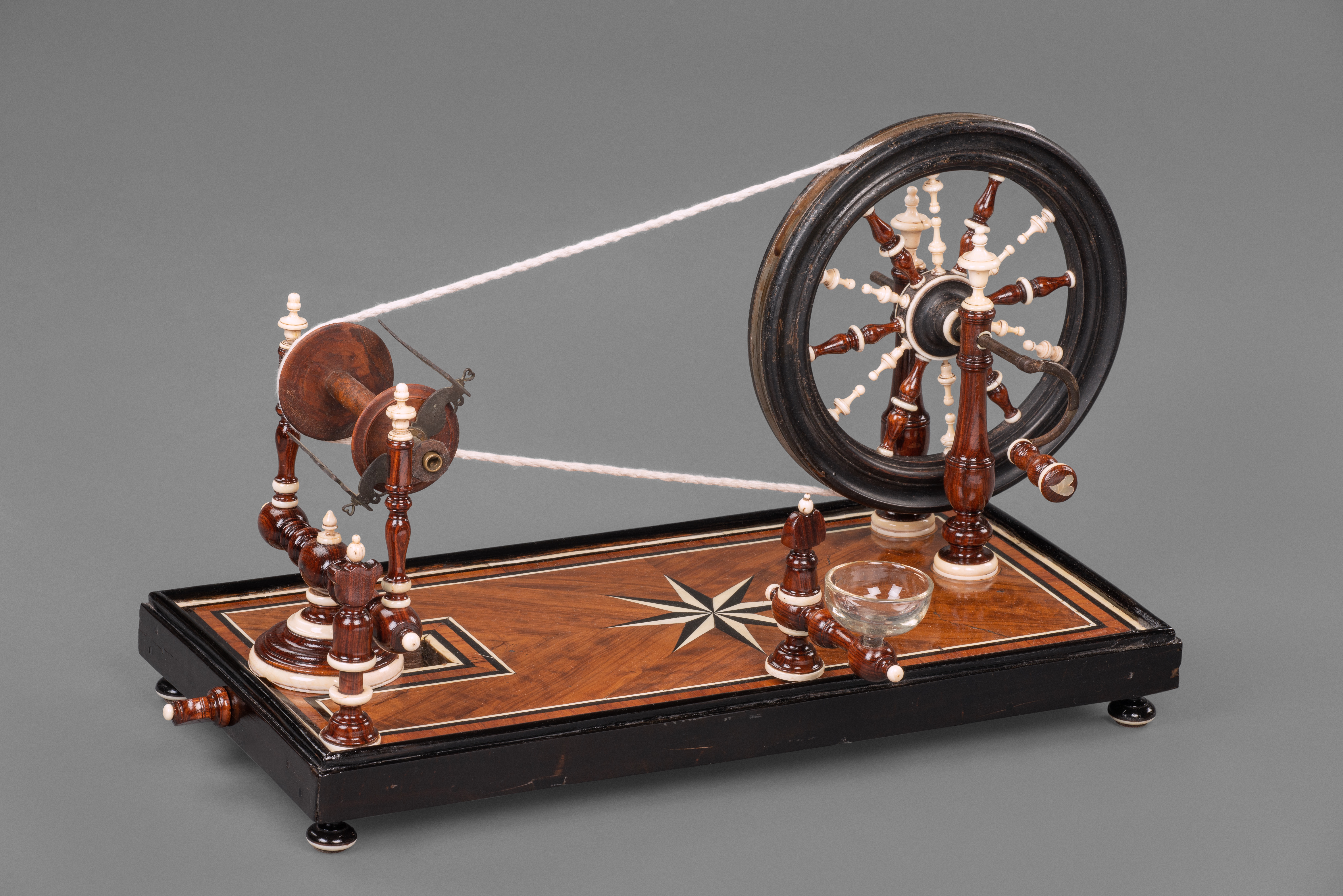 A Rare Kingwood, mother of pearl, Ebony and Ivory Spinning wheel